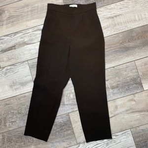 Babaton women’s black flat front crop pant with a  skinny leg.